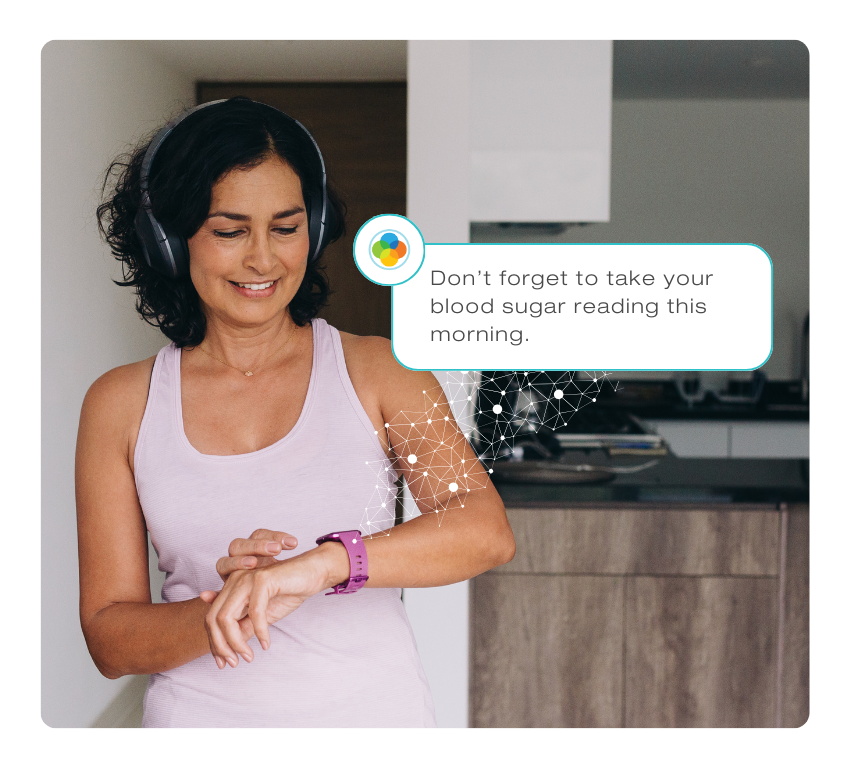 Woman looking at smart watch with Life365 Personalyze notification